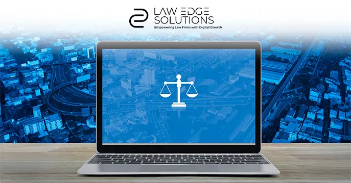 Laptop displaying scales of justice on a blue background, symbolizing legal practices and web design solutions
